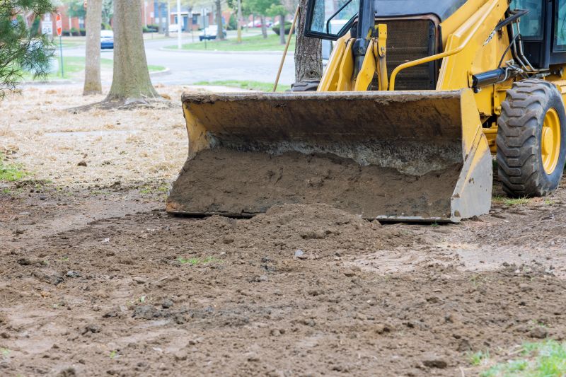 Yard grading equipment in action